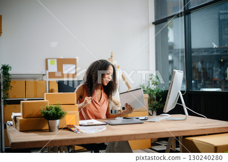eelance woman working at home office, BOX,tablet and laptop online, marketing, packaging, delivery, e-commerce concept eelance woman working at home office, BOX,tablet and laptop online, marketing, packaging, delivery, e-commerce concept 130240280