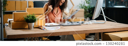 eelance woman working at home office, BOX,tablet and laptop online, marketing, packaging, delivery, e-commerce concept eelance woman working at home office, BOX,tablet and laptop online, marketing, packaging, delivery, e-commerce concept 130240281