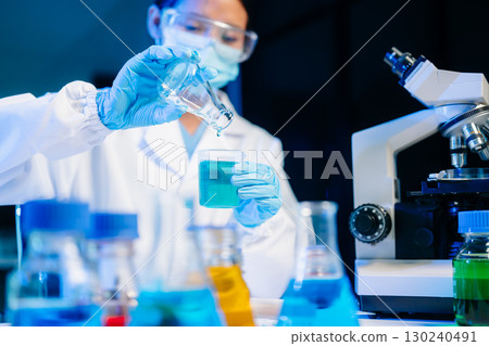 Biologist taking experiment with plants working in laboratory. 130240491