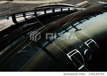 Black sports car interior through window 130240764