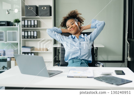 Overworked young Asian businesswoman office worker suffering from neck pain after had a long day 130240951