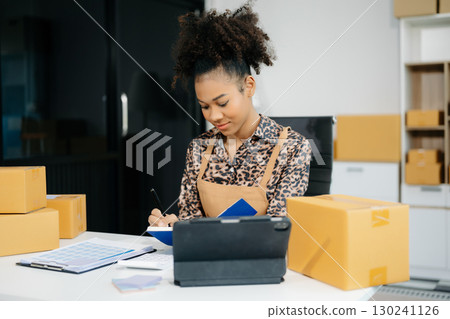Small business entrepreneur SME freelance woman working at home office, BOX,tablet and laptop online, marketing, packaging Small business entrepreneur SME freelance woman working at home office, BOX,tablet and laptop online, marketing, packaging 130241126