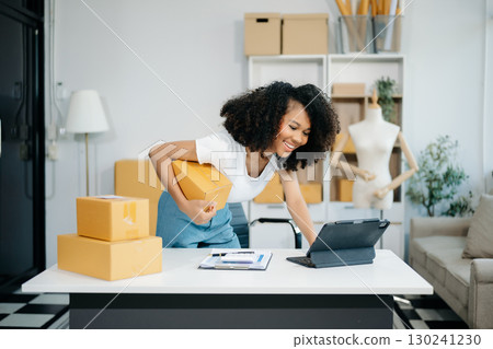 Small business entrepreneur SME freelance woman working at home office, BOX,tablet and laptop online, marketing, packaging 130241230
