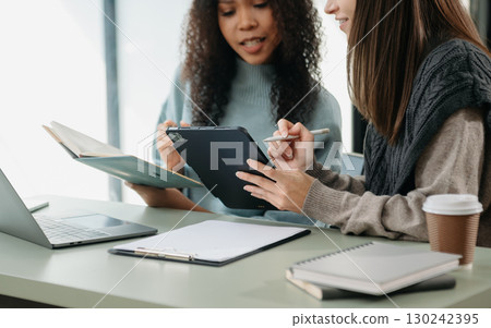 Team work process. Photo young business crew working with new startup project. Project managers meeting. Analyze plans, papers. 130242395