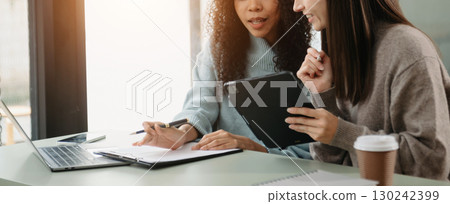 Team work process. Photo young business crew working with new startup project. Project managers meeting. Analyze plans, papers. 130242399