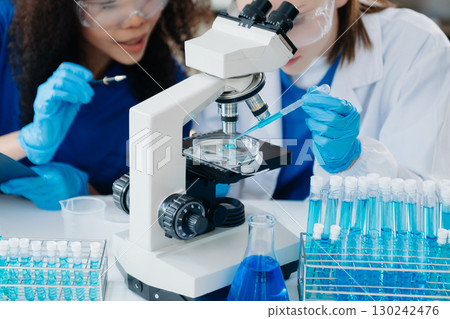 Scientist two woman with tablet and laptop, laboratory and ecofriendly science. Agriculture, research and scientists with online reading, test samples 130242476