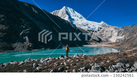 Backpacking woman hiking on high altitude mountains Backpacking woman hiking on high altitude mountains 130242561