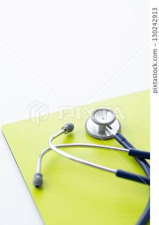 Blue stethoscope and binder 130242913