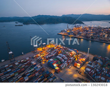 Aerial view of Yantian international container terminal at night in Shenzhen city, China Aerial view of Yantian international container terminal at night in Shenzhen city, China 130243018