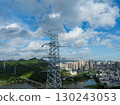 Aerial view of high voltage electricity tower on mountain 130243053