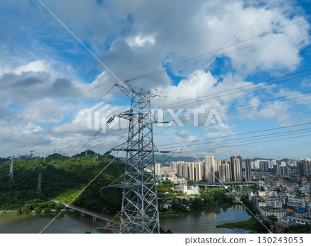 Aerial view of high voltage electricity tower on mountain 130243053
