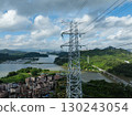 Aerial view of high voltage electricity tower on mountain 130243054