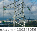 Aerial view of high voltage electricity tower on mountain 130243056