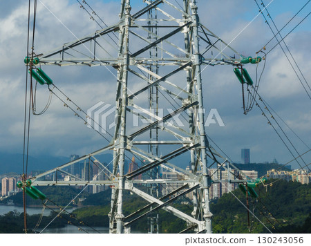 Aerial view of high voltage electricity tower on mountain 130243056