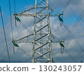 Aerial view of high voltage electric tower in city 130243057