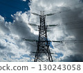 Aerial view of high voltage electric tower in city 130243058