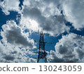 Aerial view of high voltage electric tower in city 130243059