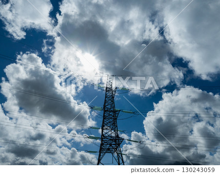Aerial view of high voltage electric tower in city 130243059