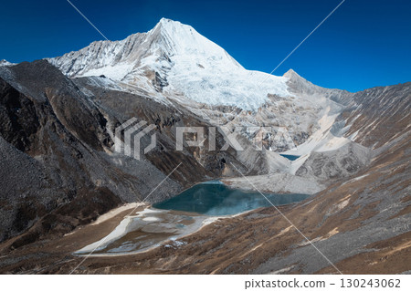 Aerial view of beautiful snow capped mountain and lake landscape in Tibet, China Aerial view of beautiful snow capped mountain and lake landscape in Tibet, China 130243062