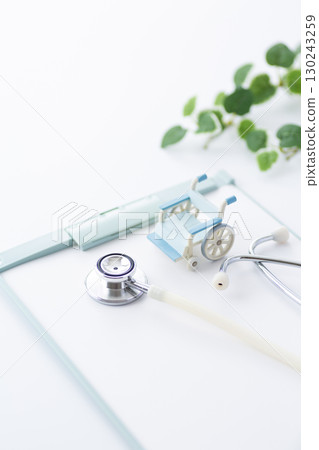 Stethoscope, binder and wheelchair 130243259