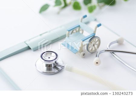 Stethoscope, binder and wheelchair Stethoscope, binder and wheelchair 130243273
