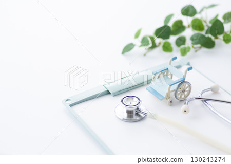 Stethoscope, binder and wheelchair 130243274