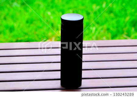 Water bottle on a park table Water bottle on a park table 130243289
