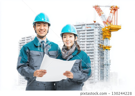 a young japanese male and female construction worker in uniform, holding documents against modern office buildings under construction 130244228