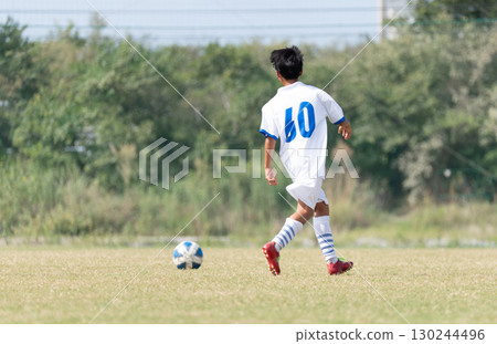 Junior high school boys playing soccer Junior high school boys playing soccer 130244496