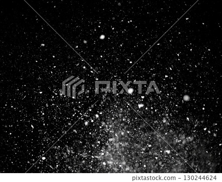 AI-generated image of snow falling on a black background. 130244624