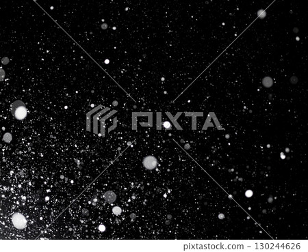 AI-generated image of snow falling on a black background. 130244626