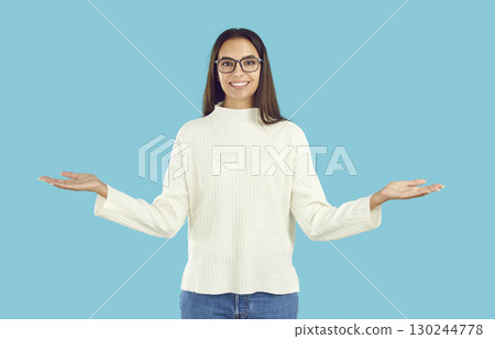 Cheerful girl doing welcome gesture spread her arms to sides 130244778