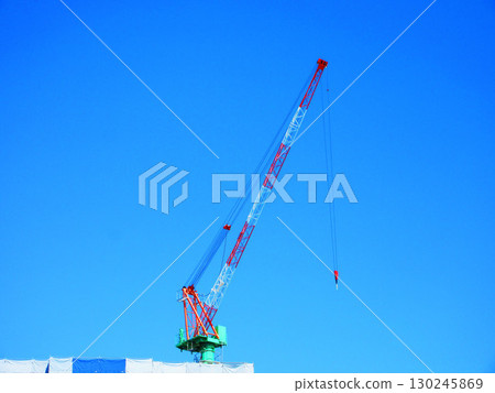 Tower cranes and blue sky during construction 130245869