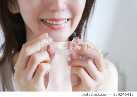 Woman wearing a mouthpiece 130246412