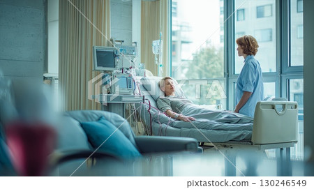 Doctor visiting patient resting in hospital bed after successful surgery 130246549