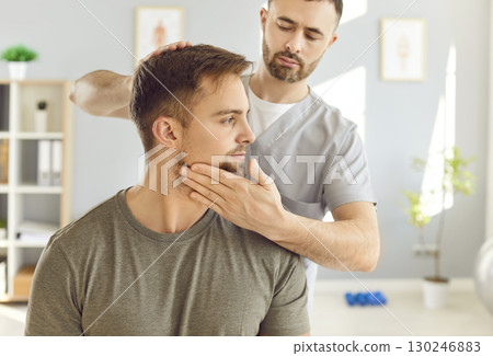 Masseur Massaging Patient's Neck During Rehabilitation Or Physiotherapy 130246883