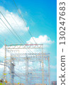 A nostalgic summer memory. A steel tower soaring against the blue sky and a nostalgic landscape. 130247683