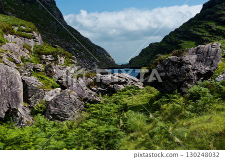 Landscape view of the scenic Gap of Dunloe in County Kerry, Ireland during the daytime. 130248032