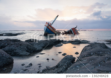 Old wrecked fishing boat on coast of Ang Sila Village, Chonburi Province of thailand. 130248428