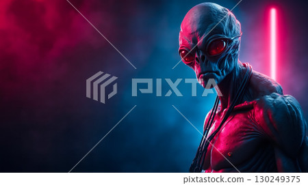 A man with red eyes standing in front of a red light A man with red eyes standing in front of a red light 130249375