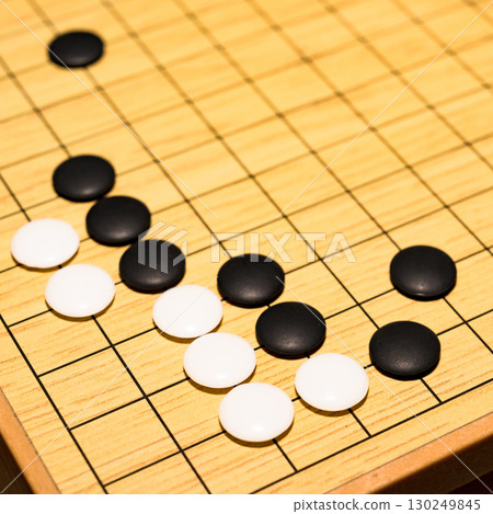 Go is a board game that is said to have originated in China. [Image of a Go game] 130249845