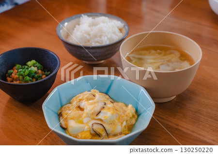 A Japanese breakfast of rice, miso soup, egg, and natto 130250220