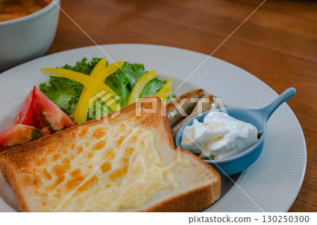 Breakfast of cheese toast, salad and yogurt 130250300