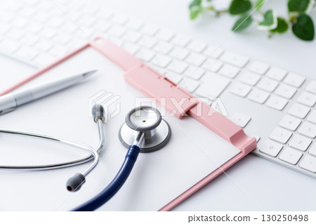 Pink binder and stethoscope 130250498