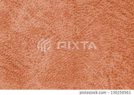 Close up, macro texture of orange suede, faux leather surface with natural pebble grain pattern Close up, macro texture of orange suede, faux leather surface with natural pebble grain pattern 130250561