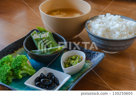 Japanese breakfast: rice, miso soup, and vegetable side dishes Japanese breakfast: rice, miso soup, and vegetable side dishes 130250605