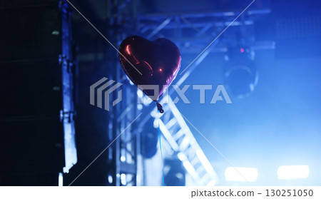 Red Heart Balloon Soars At The Music Concert In Front Of The Stage Under The Spotlight 130251050