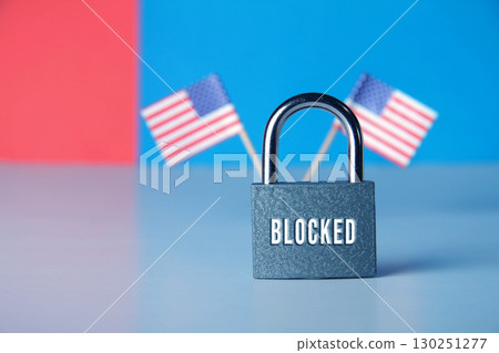 Closed padlock with the inscription lock on the background of the flag of USA 130251277