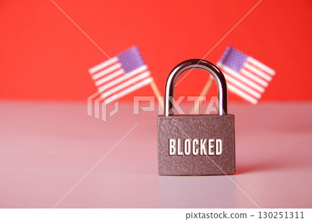 Closed padlock with the inscription lock on the background of the flag of USA. Closed padlock with the inscription lock on the background of the flag of USA. 130251311