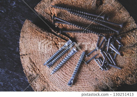 Fasteners for wood. Self-tapping screws on a wooden table. 130251413